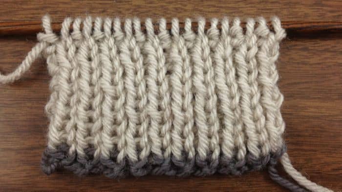 Example of the Super Stretchy Slipknot Cast On in a contrasting color knit on a 1x1 rib swatch